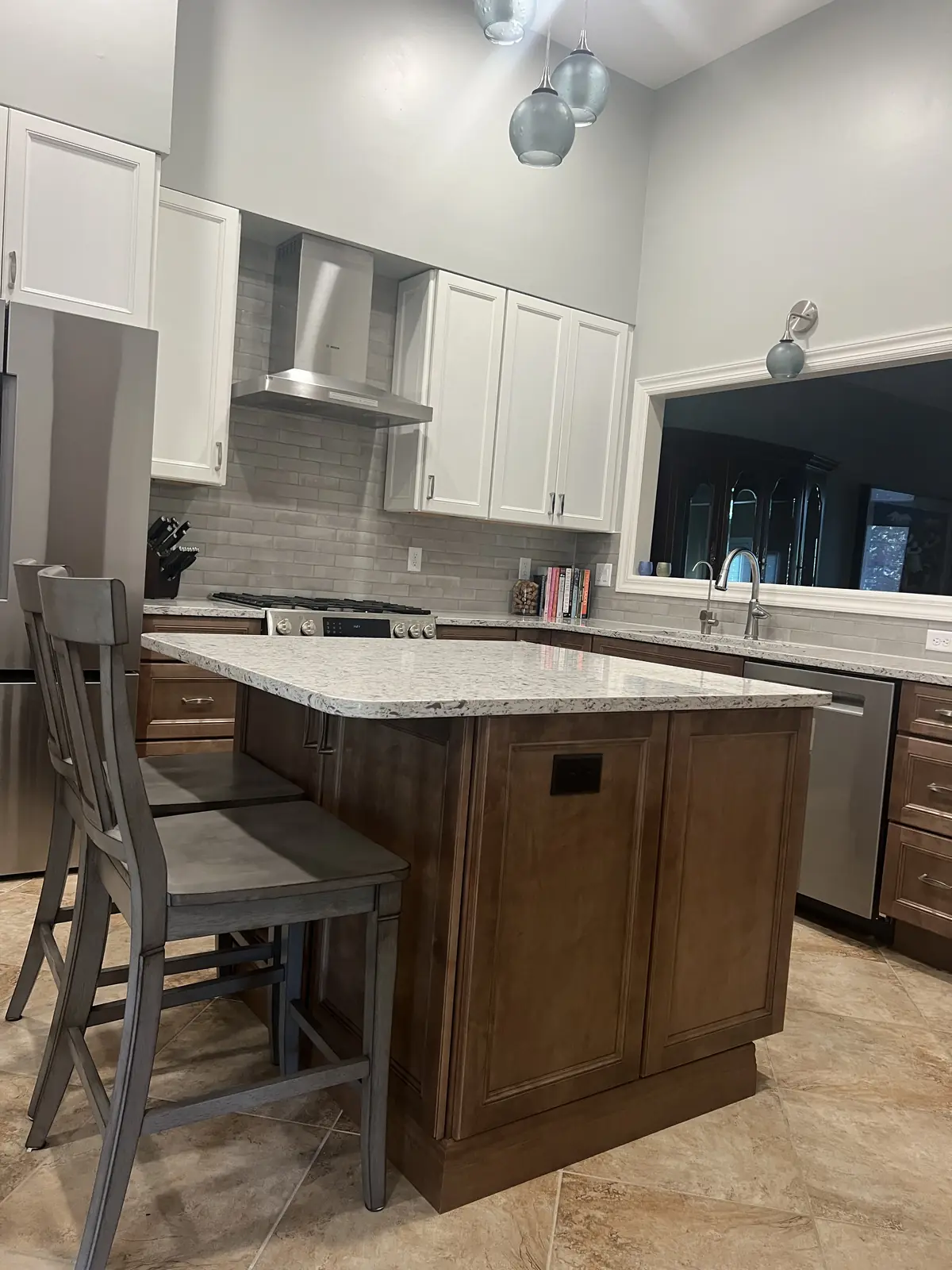 Two-tone kitchen remodel with island seating, by KM Contracting